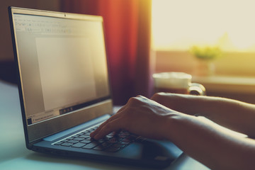 Female hand on a laptop, touchpad. remote work at the laptop. concept of Remote work or Freelance at the quarantine in the pandemic