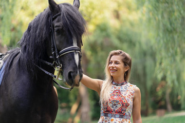 Obraz premium Young woman with a horse