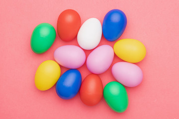 Fototapeta na wymiar Flat lay colored eggs on table
