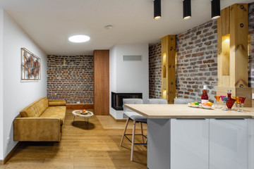 Stylish white kitchen set. Modern loft interior of studio apartment. Private house.