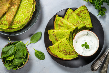 Green pancakes from spinach top view.