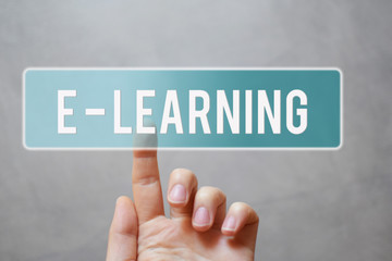 E-learning - finger pressing blue transparent button on virtual touchscreen interface on gray background with copy space for text. E-school and online education concept. 