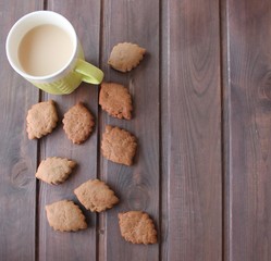 cup of coffee and cookies on wooden table