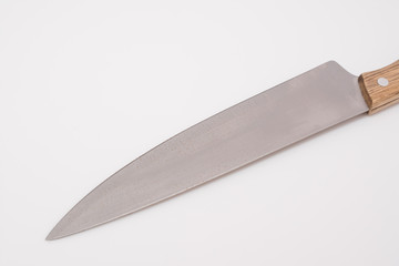 the blade of a knife on a white