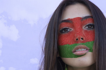 Flag of Belarus painted on a face of a smiling belarusian young woman. Copyspace.