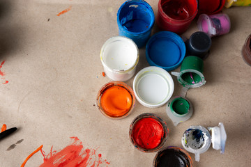 multi-colored jars with gouache on a background of craft paper. Painting. creation