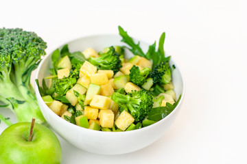  isolated dish of green salad, broccoli. Fresh, organic food for a healthy lifestyle, weight loss