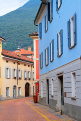 Fototapeta na wymiar colorful houses and street in bellinzona city in italy