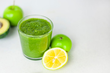 Healthy vegan green smoothie with apple, spinach, lemon. trend detox for a healthy lifestyle, weight loss, ketone diet, raw food diet