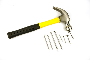 Hammer and nails of various sizes Isolated on white background.