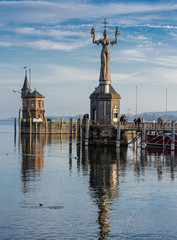 Fototapeta premium Harbour entrance of Konstanz with lighthouse and the statue of Imperia, Lake Constance (Bodensee), Baden-Wurttemberg, Germany 