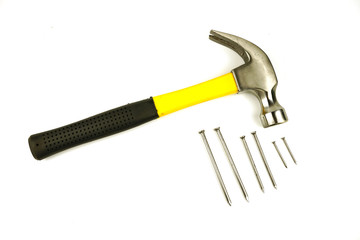 Hammer and nails of various sizes Isolated on white background.