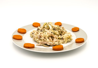 Plate of chicken hen with carrot slices