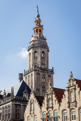 Fototapeta na wymiar Veurne, Belgium: The belfry tower against a blue sky