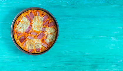 Pizza with cheese and ham. Photographed close-up.