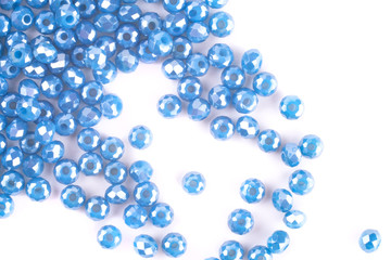 close up multi colored beads heap isolated on white