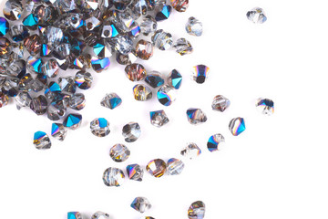 close up multi colored beads heap isolated on white