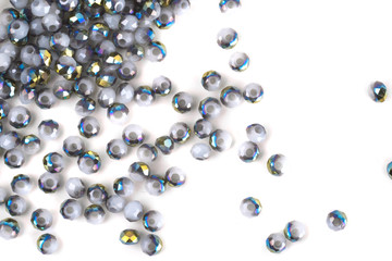 close up multi colored beads heap isolated on white