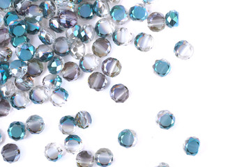 close up multi colored beads heap isolated on white