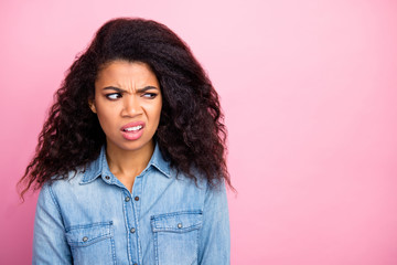 Close up photo of frustrated upset afro american girl look copyspace dislike smell grimace wear...