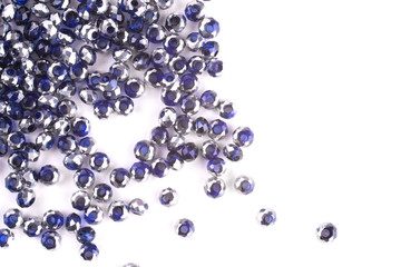 close up multi colored beads heap isolated on white