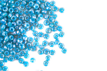 close up multi colored beads heap isolated on white