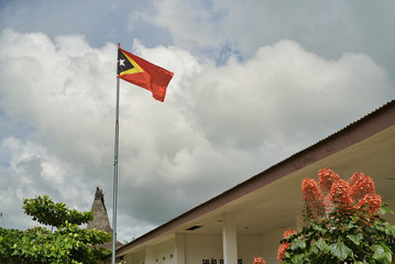 Timor Leste ( East Timor ) flag waving on the mastg. Youngest country in southeast Asia.