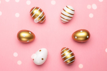 Happy Easter golden shine decorated eggs in basket isolated on pink background. For greeting card, promotion, poster, flyer, web-banner, article
