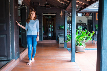 Asian woman with old house background in Lampang province