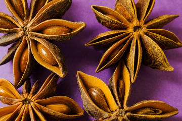 Macro view of star anise  on purple background