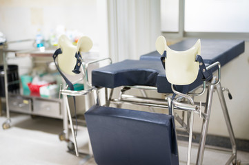 Empty gynecological chair in the clinic.Gynecological bed on the obstetrics and gynecology...