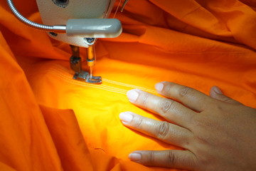 Fototapeta na wymiar Asian Woman working and Sewing Machine 