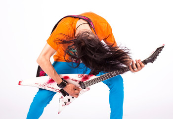 Excited young man with electric guitar shouting and shaking head over white background 