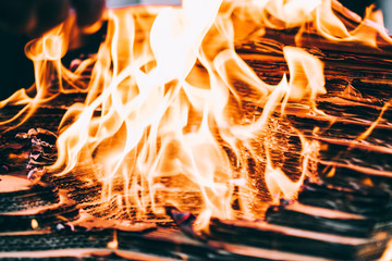 Fototapeta premium A photograph of the flames engulfing a cardboard architectural model.