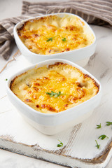 Casserole with a golden crust , mushroom julienne with baked cheese, creamy gratin.