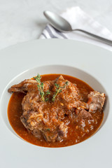 Lamb stew with aromatic herbs seen from above