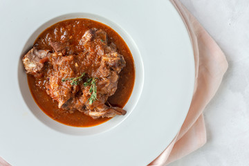 Lamb stew with aromatic herbs seen from above