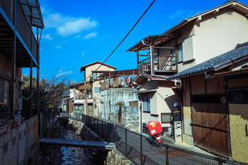 Miyajima, Japan - January 02, 2020: Cityscape to the Walking Tourists and  Itsukushima streets