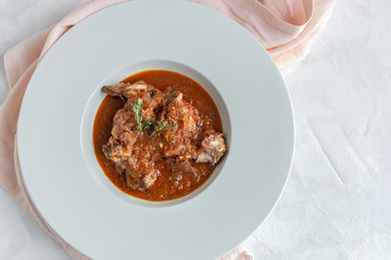 Lamb stew with aromatic herbs seen from above