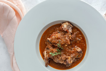 Lamb stew with aromatic herbs seen from above