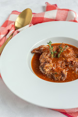 Lamb stew with aromatic herbs seen from above