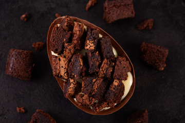 Chocolate egg with filling of brownie for Easter