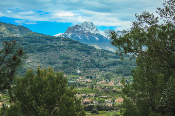 view of Serra de Tramuntana with snow capped mountains in Mallorca, Spain