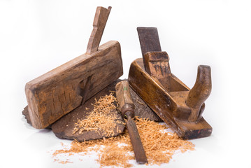 Vintage rusty plane and chisel on a white