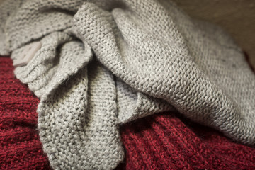 Obraz na płótnie Canvas Closeup of woolen pullover stacked at home