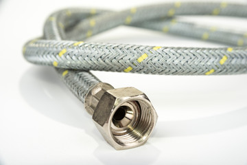 Old gas hose for cook stove on a white