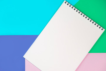 Paper notepad on the colorful background.