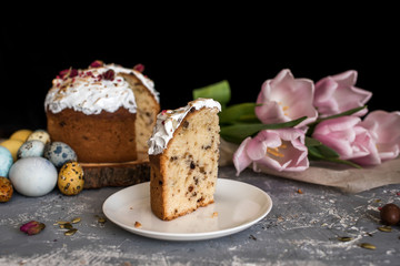 Easter cake on a tree log cabin, with beautiful painted eggs natural colors.