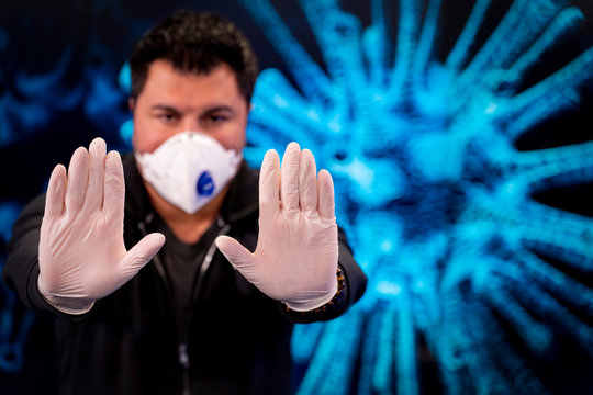 Covid-19 and Air pollution pm2.5 concept. Man wearing mask for Virus and show stop hands gesture for stop corona virus outbreak. Covid19 coronavirus and epidemic virus symptoms.