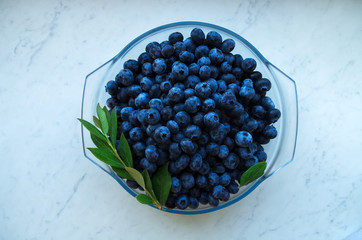Fresh organic blueberry background. Texture blueberry berries close up. 
Concept of healthy and dieting eating